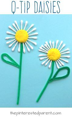 two daisies made out of paper with the words q - tip daisies