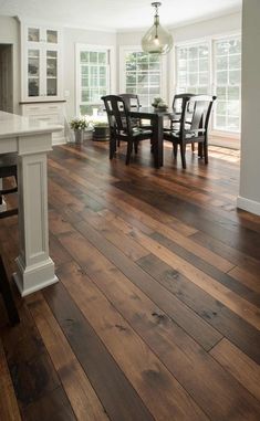 a kitchen and dining room with hardwood floors