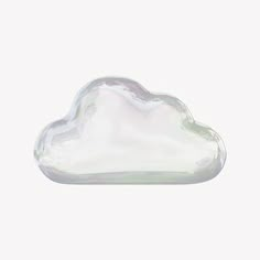 a white cloud shaped object sitting on top of a table