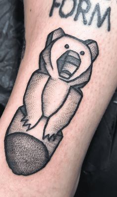 a black and white photo of a bear with the word form on it's arm