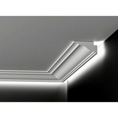 a ceiling light that is on top of a white wall in a room with black walls