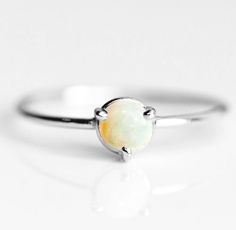 Artisan Ethiopian Opal Ring, 925 Sterling Silver, Round Gemstone, Affordable Silver Ring, Cheap Ring, Can Be Personalized, Christmas, Sale Ring Metal :- 925 Sterling Silver (Stamp on the Product) **Gemstone Size depends on the Ring Size.** **The Product you will receive may vary from the image as no two gemstone are similar and images cannot define exact product definitions.** Shipping Policy:- I mainly use DHLE, PPS, FedEx for the shipping of goods depending on the amount and days that you have Silver Minimalist Opal Rings, White Opal Stackable Rings As Gift, White Opal Stackable Rings Gift, Silver Opal Dainty Rings, Minimalist White Gold Opal Ring In Sterling Silver, Dainty Silver Opal Rings, Dainty Opal Silver Rings, Silver Opal Stackable Rings As Gift, White Stackable Sterling Silver Opal Ring