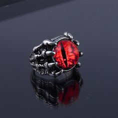 Why Eye Of Sauron Ring Is Necessary? The Best Eye of Sauron Ring is a reminder of the power of Sauron and the dark lord's influence over Middle-earth. It is also a physical representation of Sauron's all-seeing gaze, which is said to be able to penetrate even the strongest defenses. Sauron jewelry is that they are designed to protect the wearer from evil and ward off the evil that has been directed at them. Wearing any piece of jewelry with the Sauron symbol on it provides the wearer with both p Evil Eye Rings, Eye Rings, Man Bars, Monster Eyes, Red Ring, Claw Ring, Devil Eye, Woman Personality, Fashion Creative