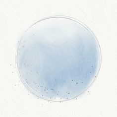 a blue circle with black dots in the middle on a white background that looks like watercolor