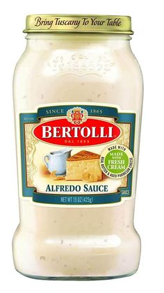 a jar of bertolli alfredo sauce on a white background