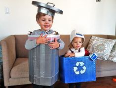 two children dressed in costumes standing next to each other