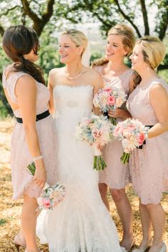 the bride and her bridesmaids are laughing together