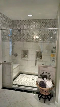 a bathroom with a walk in shower next to a white sink and bathtub area