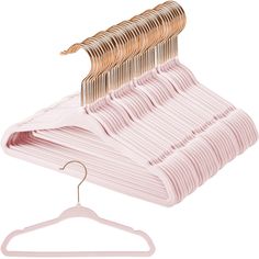 a pink hanger with five rows of clothes hanging from it's hooks and two pairs of gold colored clips