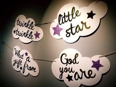 some little stars are hanging on the wall with lights around them that read twinkle, twinkle, star, god, and you'ree