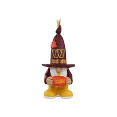 a figurine with a hat and boots on it's head, holding an orange ball