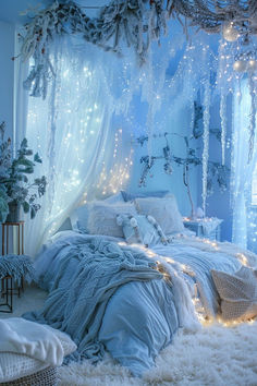 a bedroom decorated in blue and white with lights on the ceiling, bedding and pillows