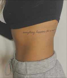 a woman's stomach with the words everything happens for a reason written on it