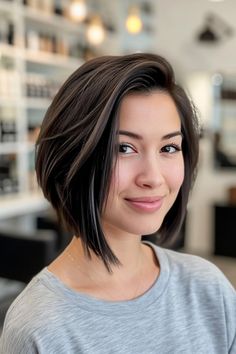 This dark, chin-length bob is elevated with chestnut highlights, offering a classic look with a twist. Tap the link for more style inspiration! Chin Length Bob Dark Hair, Chin Length Black Hair, Dark Chin Length Hair, Brunette Hair Chin Length, Dark Brown Chin Length Hair, Chestnut Highlights, Shoulder Length Waves, Black Pixie Cut, Long Pixie Cuts