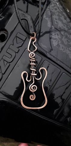 unisex necklace pendants necklace handmade design handmade wire wrap jewelry Guitar Earrings, Guitar Crafts, Guitar String Jewelry, Guitar Pick Jewelry, Guitar Pick Necklace, Accessory Inspo, Handmade Guitar, Wire Wrap Jewelry, Pendant Tutorial