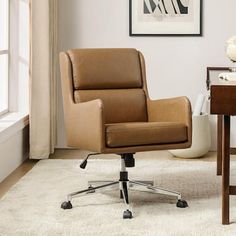 a brown office chair sitting on top of a white rug in front of a window