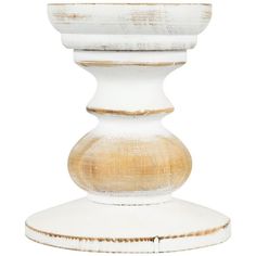 a white vase sitting on top of a wooden stand