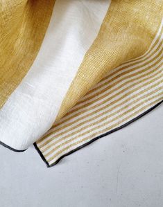 a yellow and white striped cloth on a table