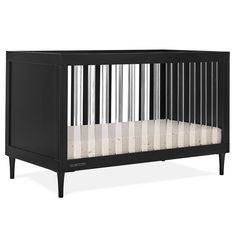 a black crib with white sheets on the bottom and sides, in front of a white background