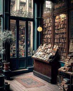 an old book store with lots of books on display in the windows and wooden floors