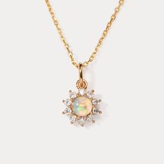 Elevate your everyday style with the timeless beauty of the Selenichast Opal Necklace. Designed for effortless elegance, this stunning necklace features a mesmerizing opal pendant that exudes a captivating play of colors. Its sleek and versatile design makes it the perfect accessory for any occasion, whether it's a casual outing or a formal affair. The high-quality craftsmanship ensures durability and longevity, allowing you to enjoy its beauty day after day. Make a statement with the Selenichas Elegant Round Opal Necklace, Elegant Opal Clavicle Chain Jewelry, Elegant Opal Round Pendant Jewelry, Elegant Round Opal Pendant Jewelry, Elegant Ethiopian Opal Pendant Necklace, Elegant Opal Necklaces, Elegant Ethiopian Opal Gemstone Necklaces, Yellow Gold Opal Necklace For Anniversary, Elegant Ethiopian Opal Necklace In Yellow Gold