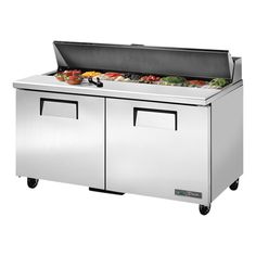 two stainless steel freezers with food on top