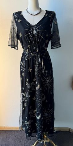 Size: L Brand: Stardust  Closure: Back zipper. Waist tie. Condition: NWT Measurements (lying flat): Bust 18.5". Waist 16" (has tie to reduce). Length from shoulder seam to hem 49.5". Black Celestial Dress, Celestial Black Metal Jewelry, Black Constellation Dress, Celestial Kimono, Velvet Celestial Dress, Full Length Black Dress, Mesh Overlay, Gold Embroidery, Waist Tie