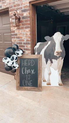 a sign that says herd, chase, it's one next to a cow