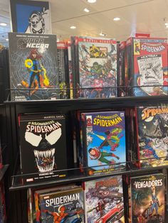 a bunch of comics are on display in a store