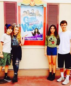 three young people standing in front of a movie poster with the words girl meets world on it