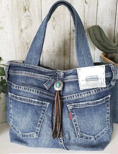 an old pair of jeans has been used as a purse