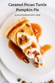 a slice of caramel pecan turtle pumpkin pie on a white plate with nuts