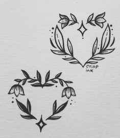 two heart shaped tattoos with leaves on them