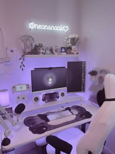 a white desk with a computer and chair in front of it on top of a shelf