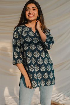 Product Description: Handcrafted Top in ajrakh hand block printed Cotton fabric. This top is a wardrobe staple and is super versatile. Features a Split V neck with full sleeve. Made in Soft cotton. Size and Fit: Model height is 5'3" and is wearing a Size S Fit: Straight Cut Contents: 1. Short top Material:  This short top is made up of 100% cotton fabric. Shirt Kurti Designs Latest, Short Kurti Designs Latest Fashion, Short Kurta With Jeans Women, Short Kutis Ideas, Kurthis Models Latest Cotton, Short Top Designs Latest, Dress Indian Style Simple Kurti Latest, Short Kurti For Jeans, Cotton Short Tops Indian