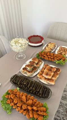 a table topped with lots of different types of food