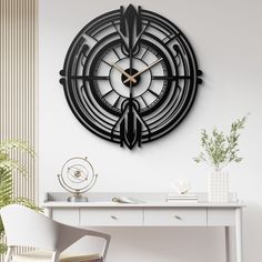 a black clock on the wall above a desk with a plant and potted plants