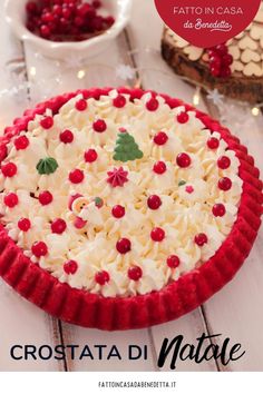 a red and white cake sitting on top of a table