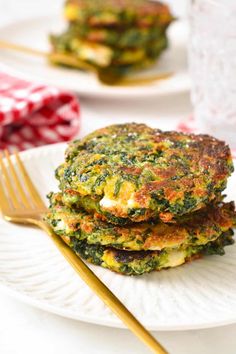 there are three pancakes on the plate and one has eggs in it with spinach