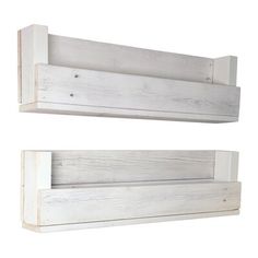 two white wooden shelves with one shelf attached to the wall