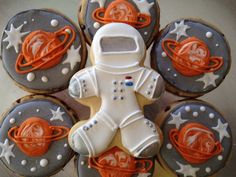 some cookies are decorated to look like astronauts