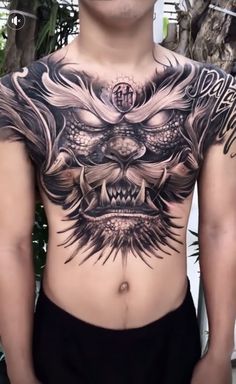 a man with a tattoo on his chest