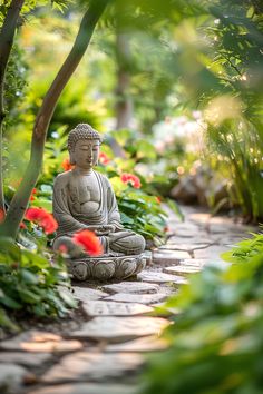 a buddha statue sitting in the middle of a garden