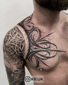 a man's chest with an intricate tattoo design on his left arm and shoulder