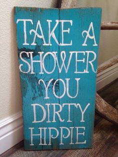 a wooden sign that says take a shower you dirty hippie