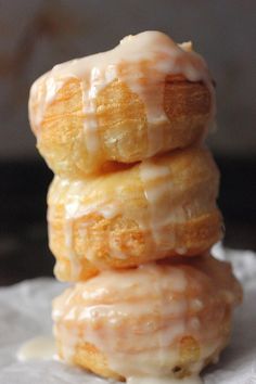 three glazed donuts stacked on top of each other