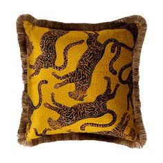 a yellow and brown pillow with leopards on it