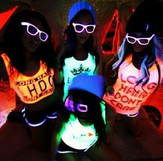 three girls wearing neon shirts and sunglasses