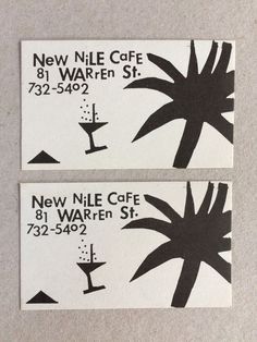 two black and white business cards with palm trees