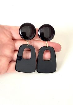 Clip on, black acrylic, drop style earrings from Olivia Divine. Large black, clip on top with abstract style acrylic drop. Lightweight. Length 7.5 cm approx . Handmade and unique design. Please take a look at my store https://www.etsy.com/uk/shop/Oliviadivine?ref=seller-platform-mcnav Modern Black Earrings For Party, Black Resin Dangle Jewelry, Black Resin Drop Earrings, Bold Black Drop Earrings, Elegant Black Resin Earrings, Black Resin Party Jewelry, Black Plastic Jewelry Gift, Turquoise Hoops, Plastic Earrings